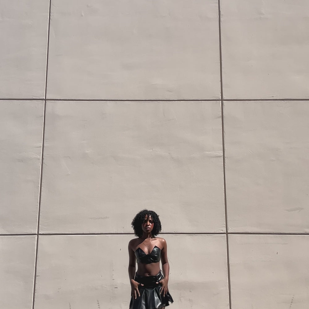 
                  
                    Load and play video in Gallery viewer, bluestory, bluestory vegan leather clothing brand made in la los angeles ca usa pleated mini skirt and triangle bra fay model influencer photoshoot
                  
                