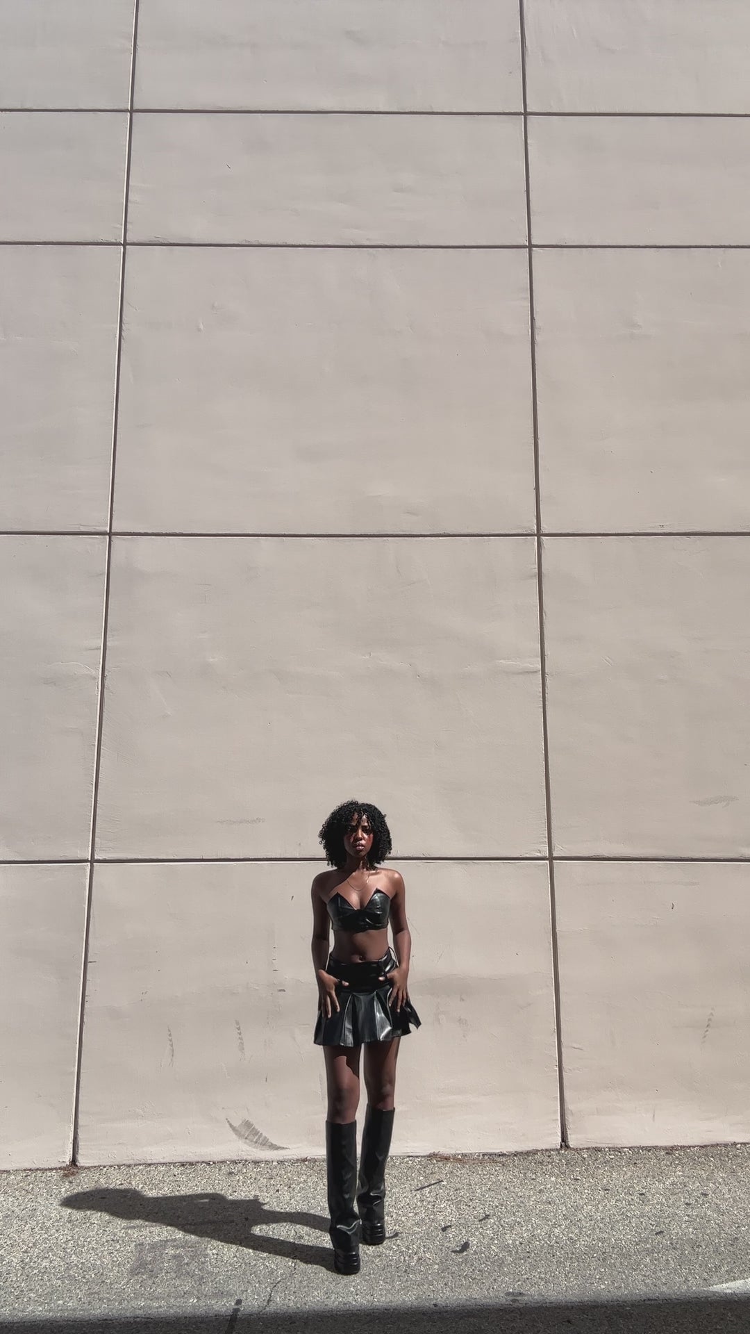 
                  
                    Load and play video in Gallery viewer, bluestory, bluestory vegan leather clothing brand made in la los angeles ca usa pleated mini skirt and triangle bra fay model influencer photoshoot
                  
                